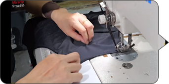 Garment panel stitching during sample making by a custom sportswear manufacturer