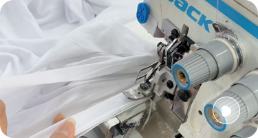 White sportswear fabric stitching under cut and sew sportswear manufacturer workflow