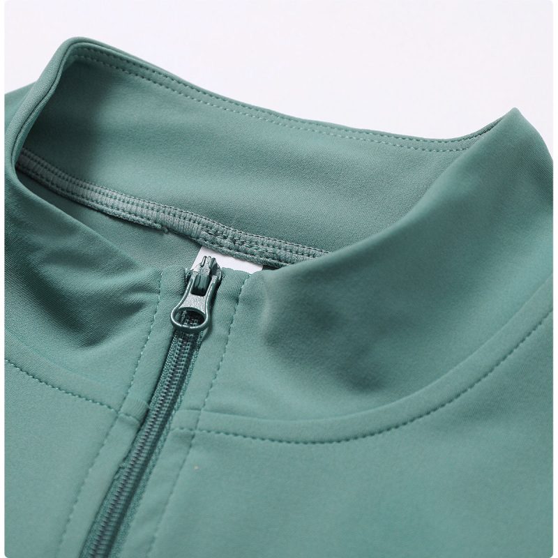 Sports jacket zipper and collar seam detail for OEM sportswear manufacturer review